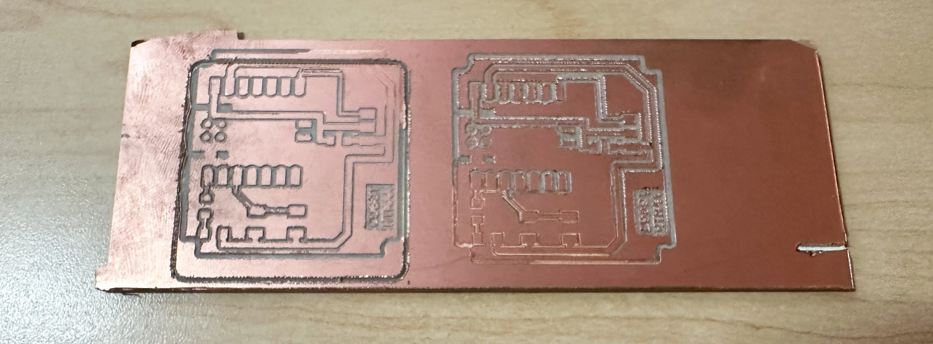 Two failed servo board attempts milled on one piece of copper stock